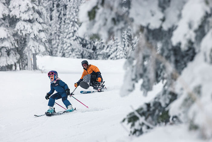 Couple on skis shredding the snow